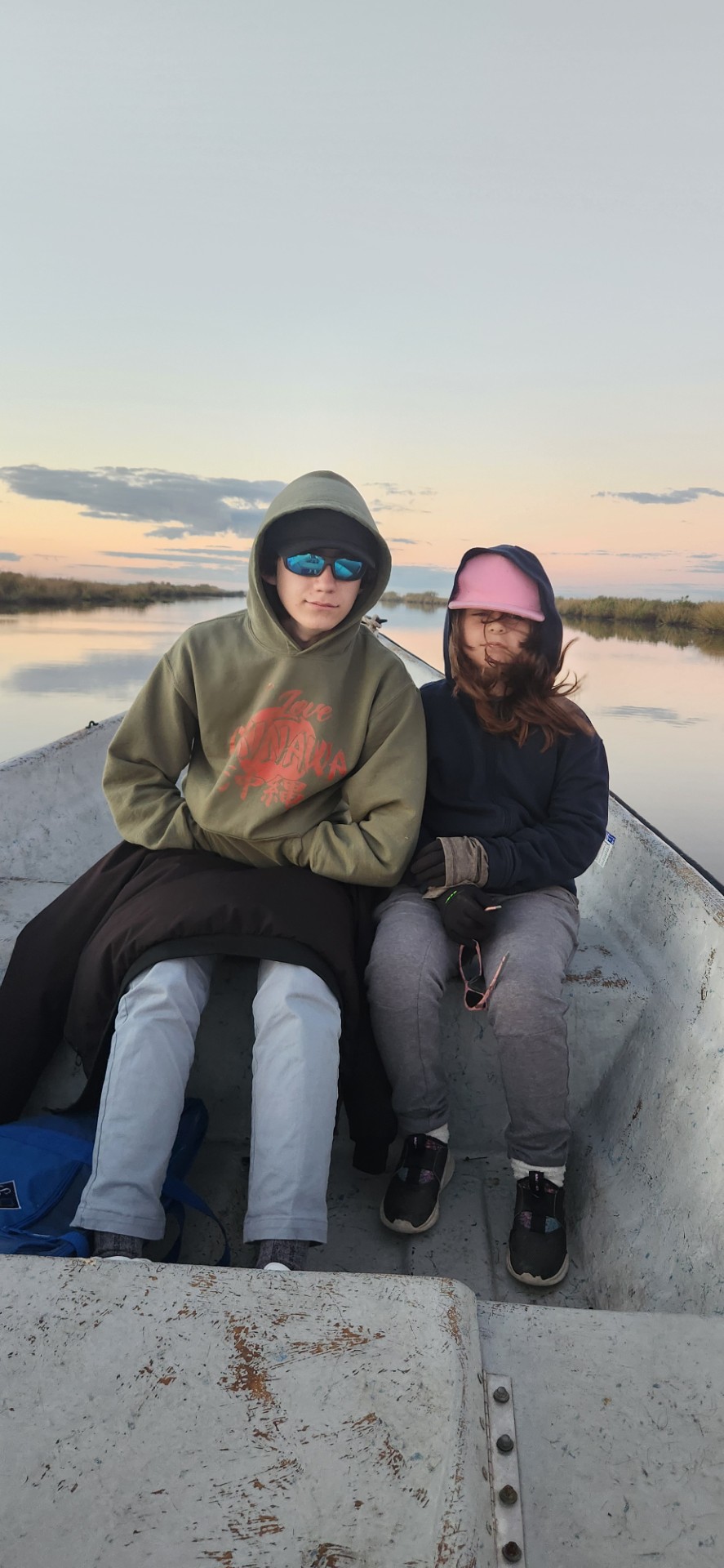 BFF member bundled up on the boat during a cool-weather day out on the bayou
